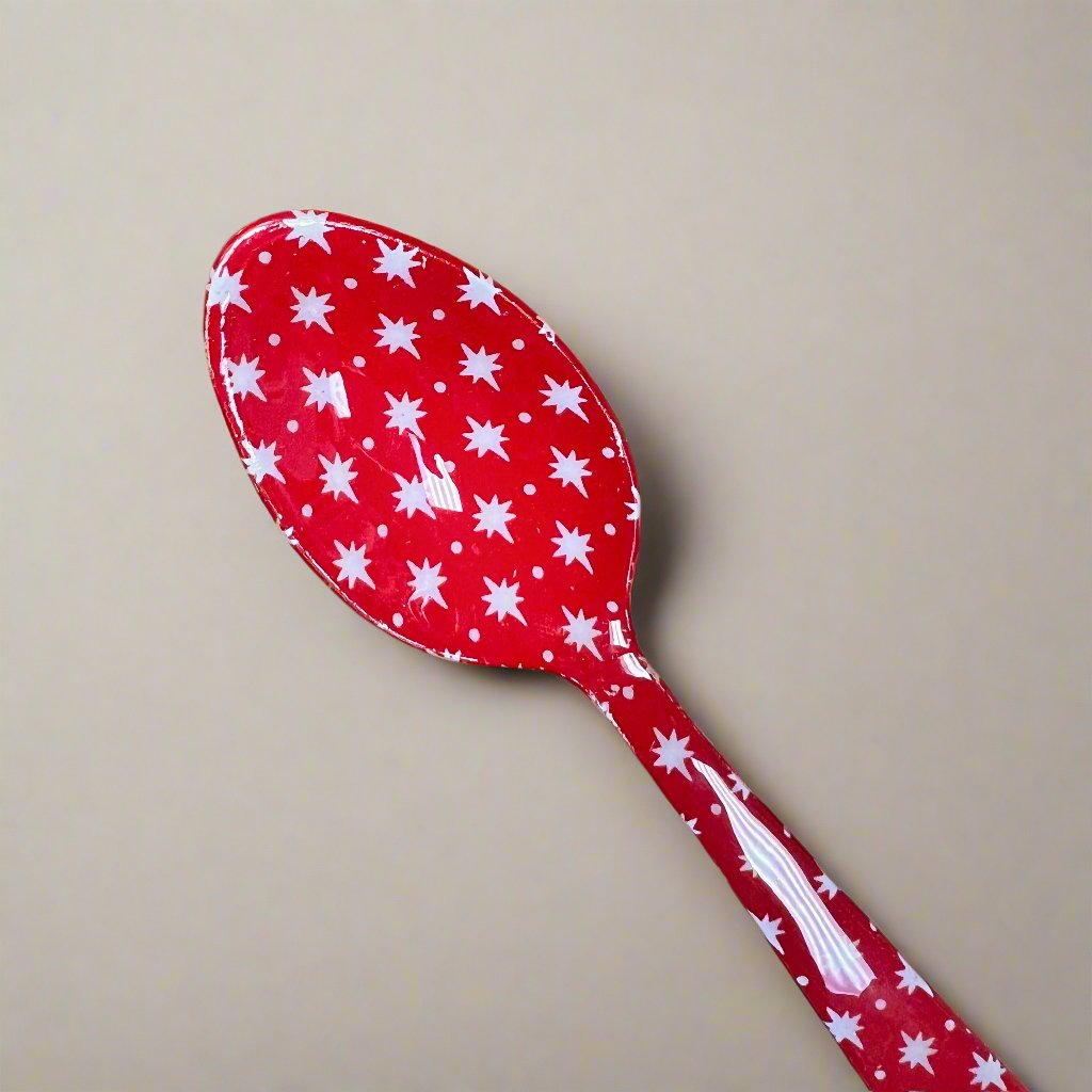 red spoon with snowflake pattern.