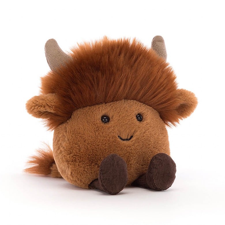 plush highland cow with smiley face on a white background