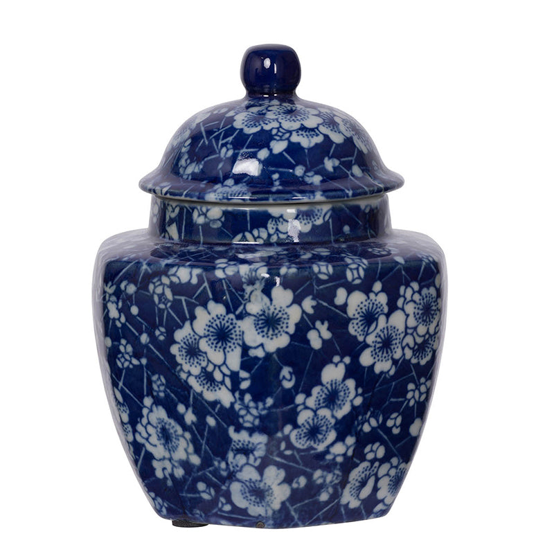 small round blue jar with lid and white flower design