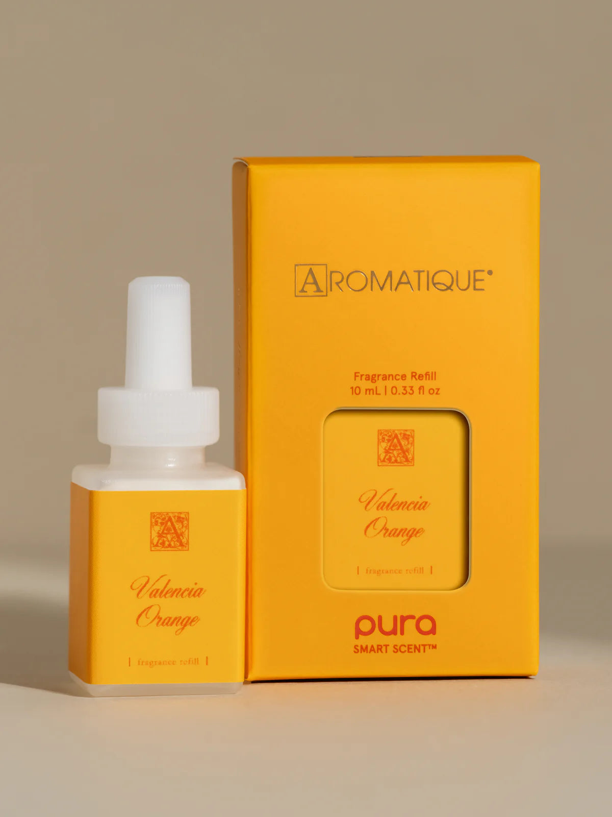 Pura Valencia Orange Refill set next to its box packaging.