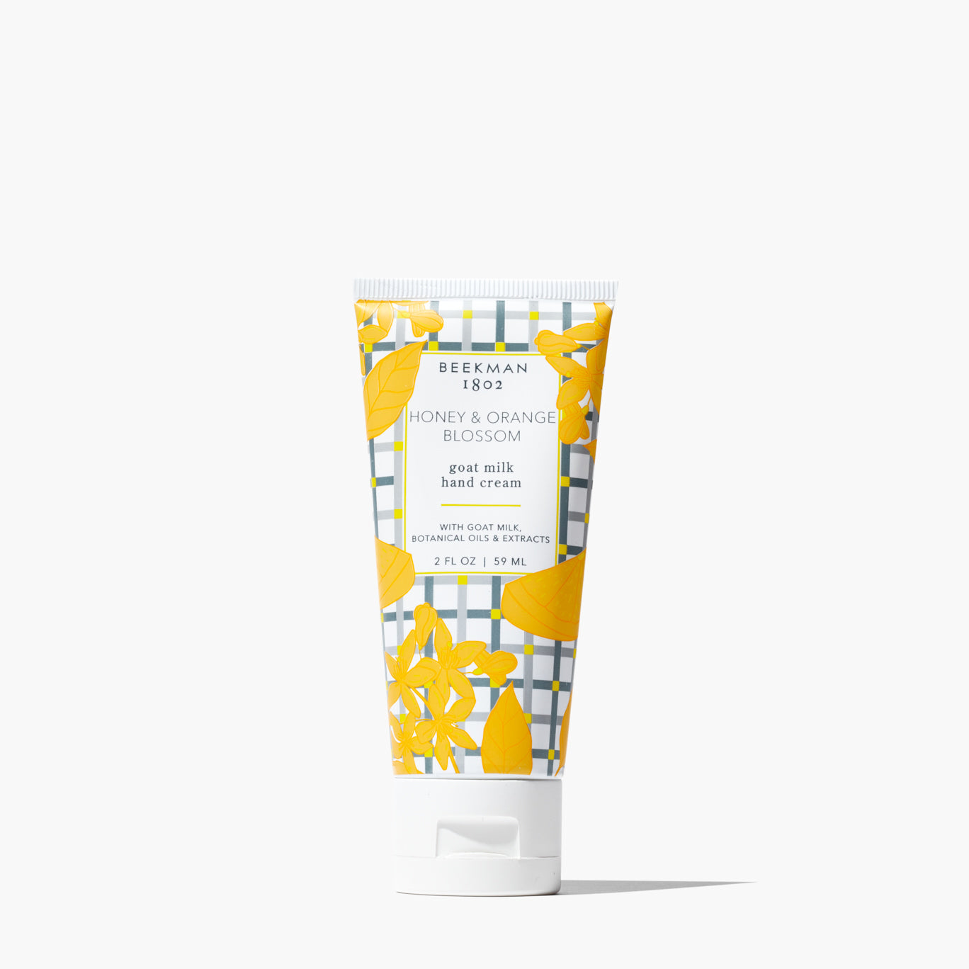 tube of Honey & Orange Blossom  Hand Cream with orange blossom and grey grid printed label