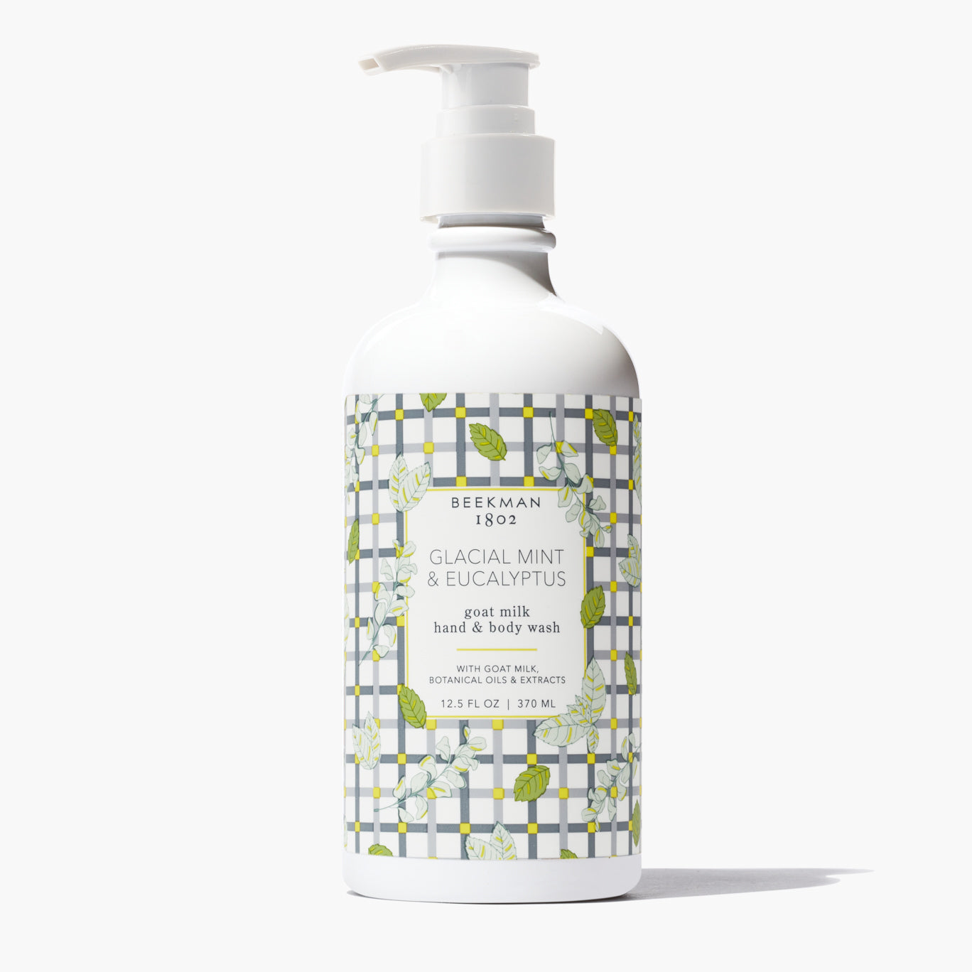 white pump bottle of Glacial Mint & Eucalyptus hand and body wash with a leaf and grey grid printed label