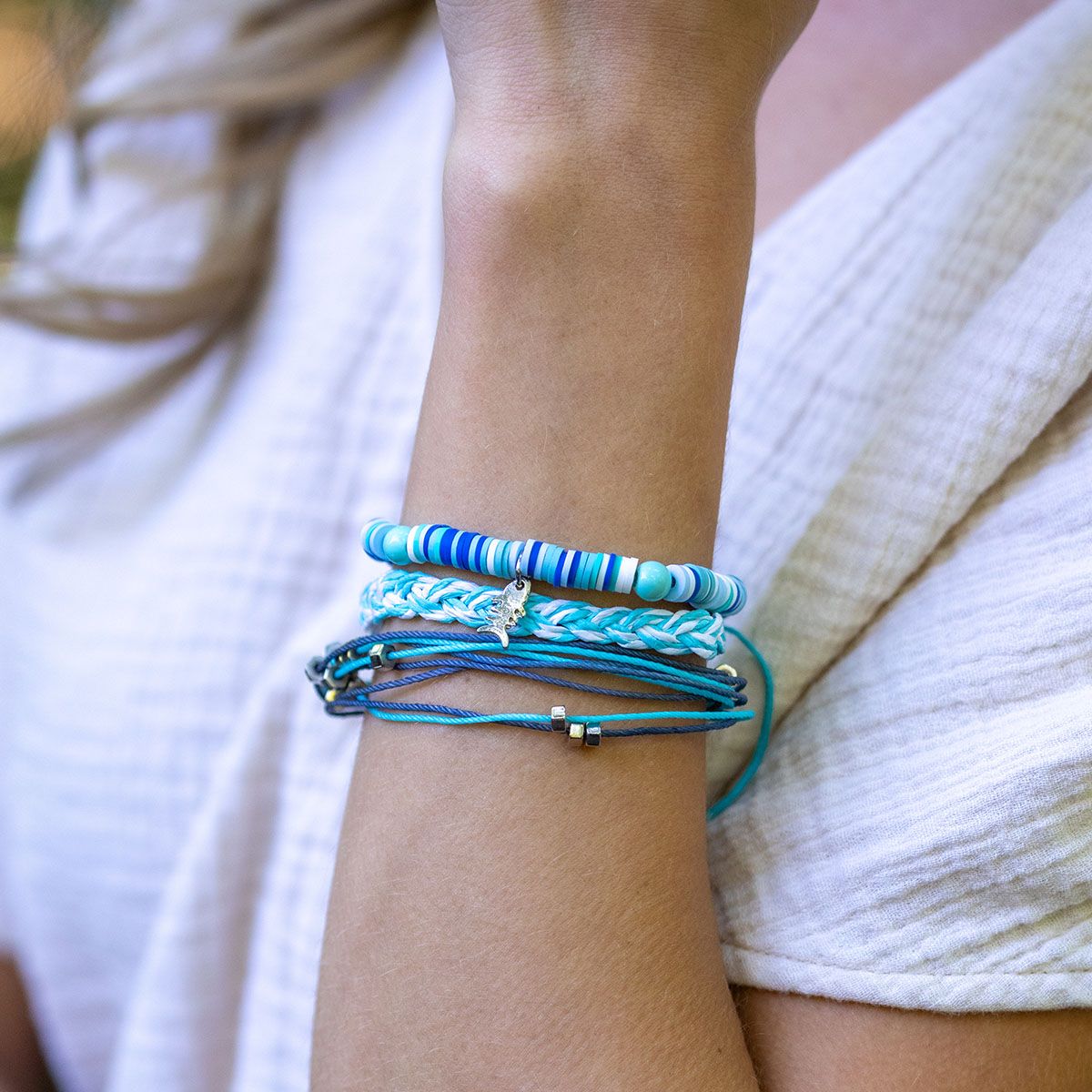 person wearing Aqua Tides bracelets