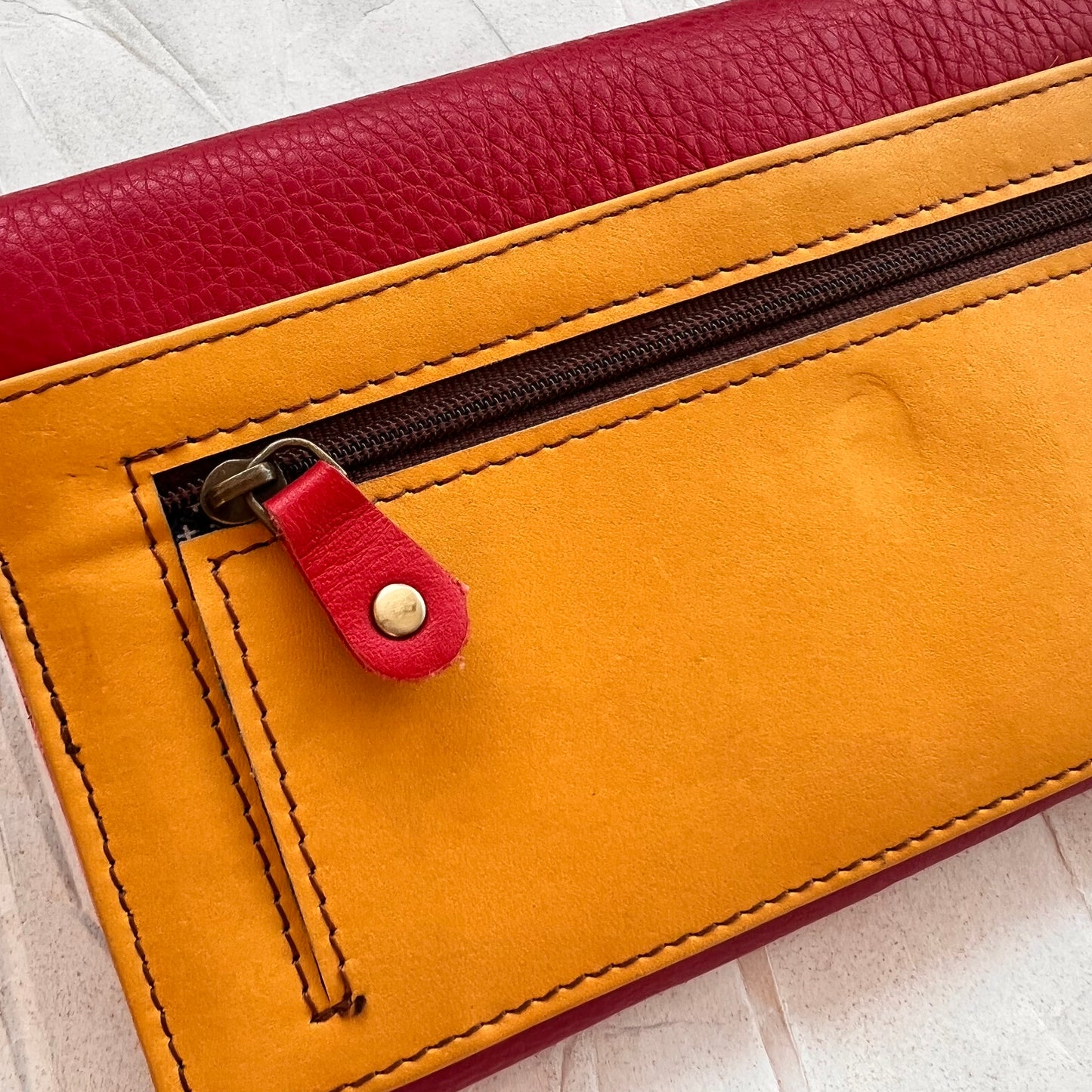 close-up of back of secret clutch wallet.