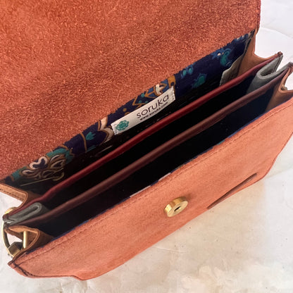 interior view of Claire purse showing 3 sections.