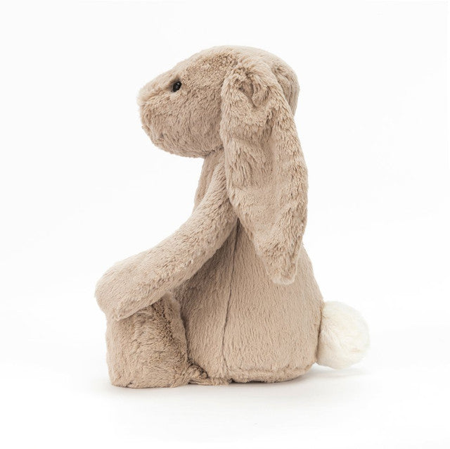 side view of Bashful Beige Bunny Huge Plush Toy