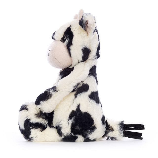 side view of Bashful Calf Plush Toy