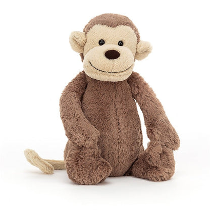 front view of the small bashful monkey plush toy on a white background