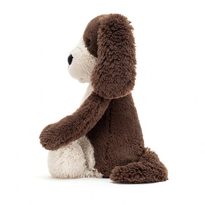 side view of the small bashful fudge puppy plush toy on a white background