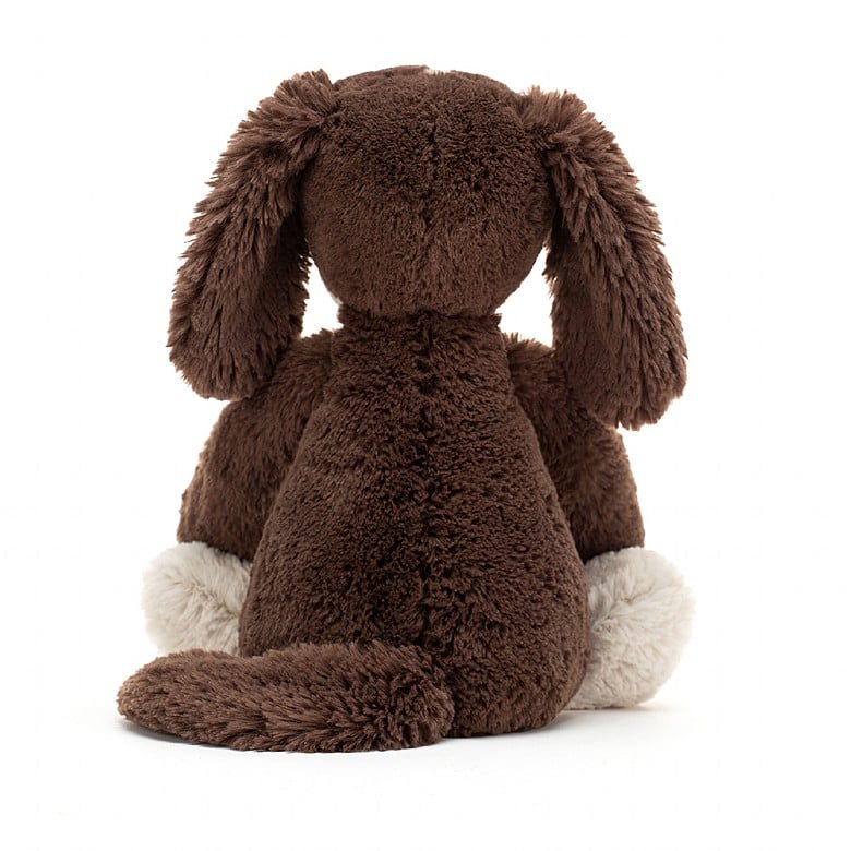 back view of the small bashful fudge puppy plush toy on a white background