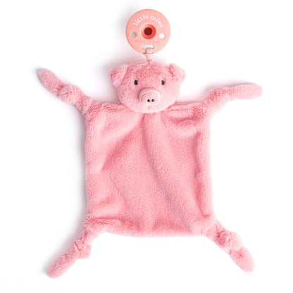 pink pig lovely with pacifier attached laying flat on a white background.