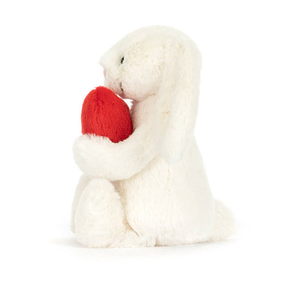 side view of Bashful Love Heart Bunny Plush Toy