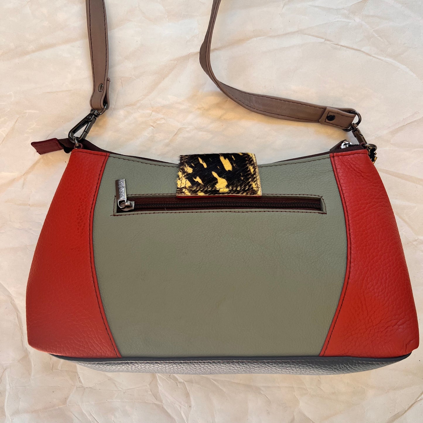 back of Amanda bag with color blocks of grey and red.