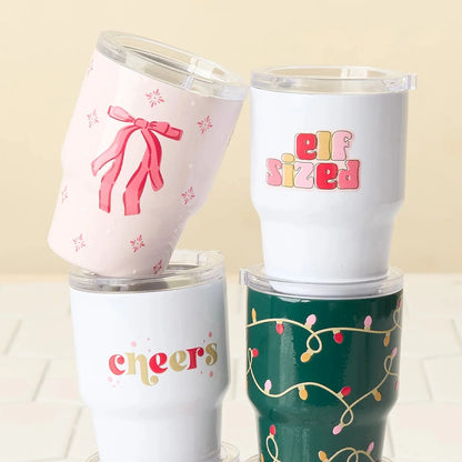 4 styles of holiday tiny tumblers stacked together.