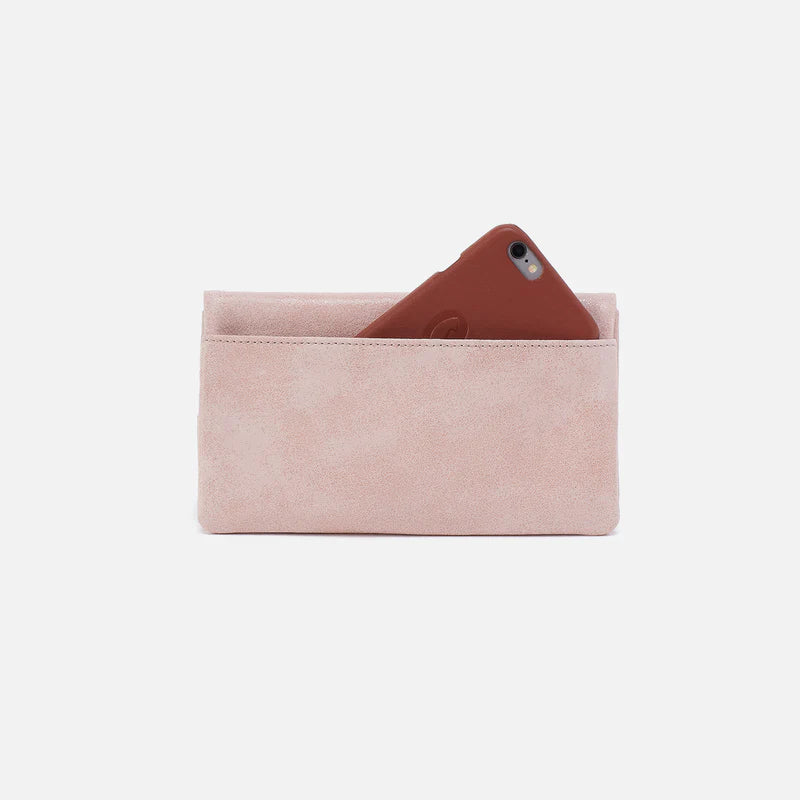 back view of blossom Lumen Continental Wallet with phone in pocket