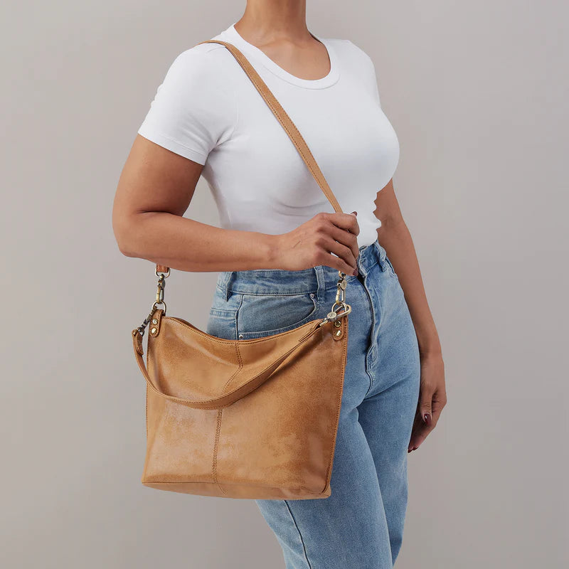 a person wearing pier in buffed leather whiskey