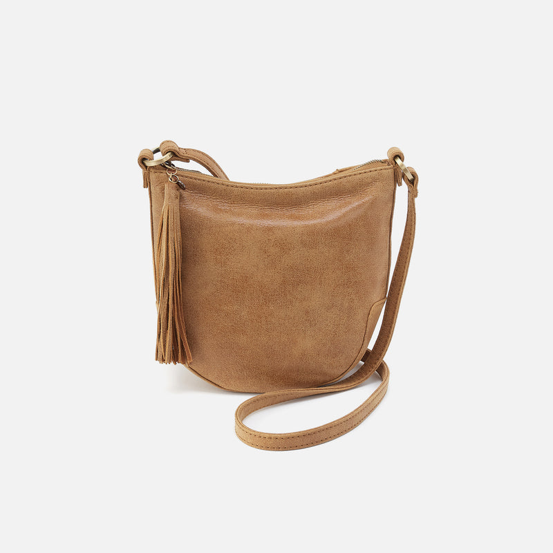 Brown leather crossbody bag on a white background