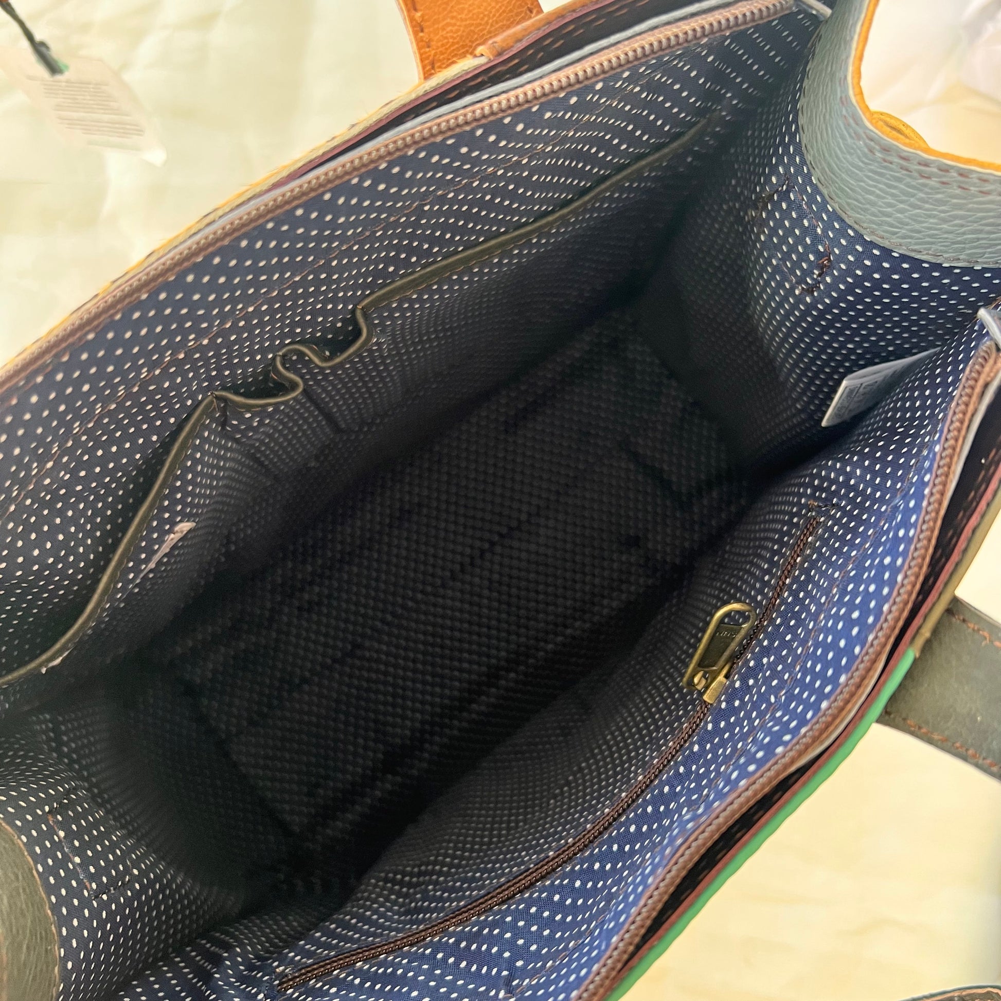 interior view of Giselle tote showing slip and zip pockets.