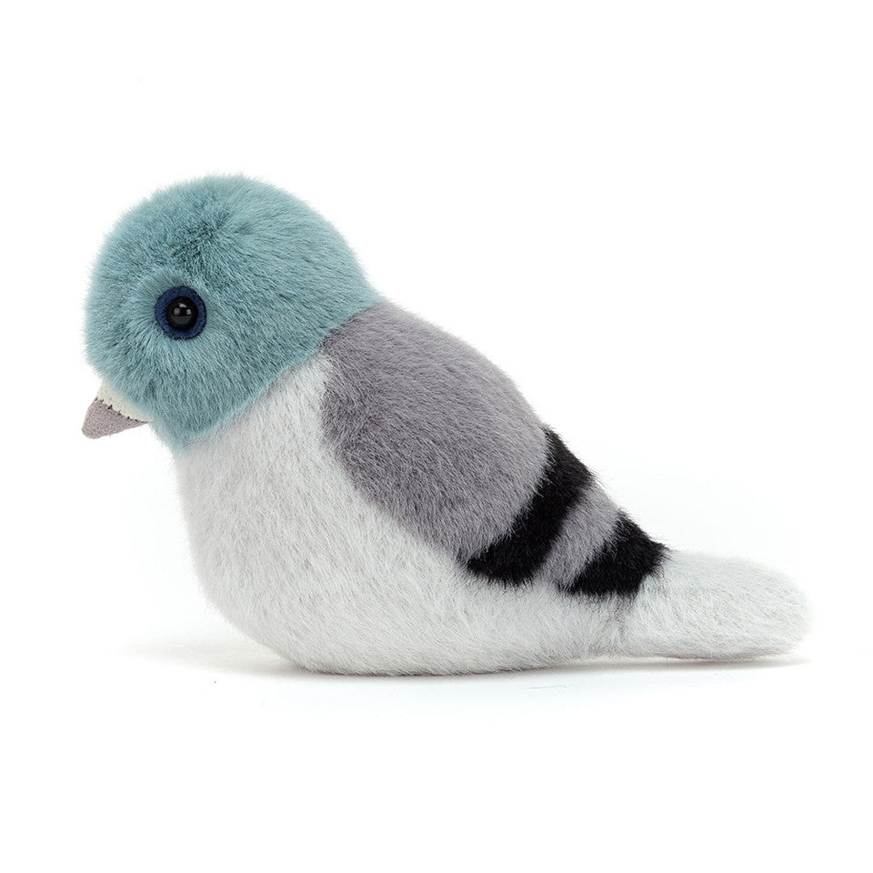 Side view of birdling pigeon plush toy.