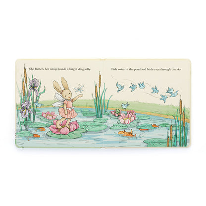 inside pages of lottie the fairy bunny book Illustration of a fairy on a lily pad with a pond scene, butterflies, and text.