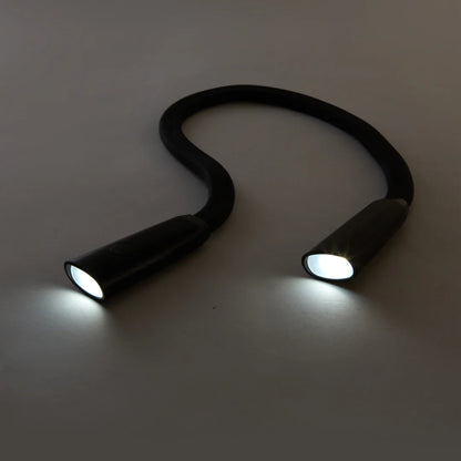 flexible neck lamp with white lights on.