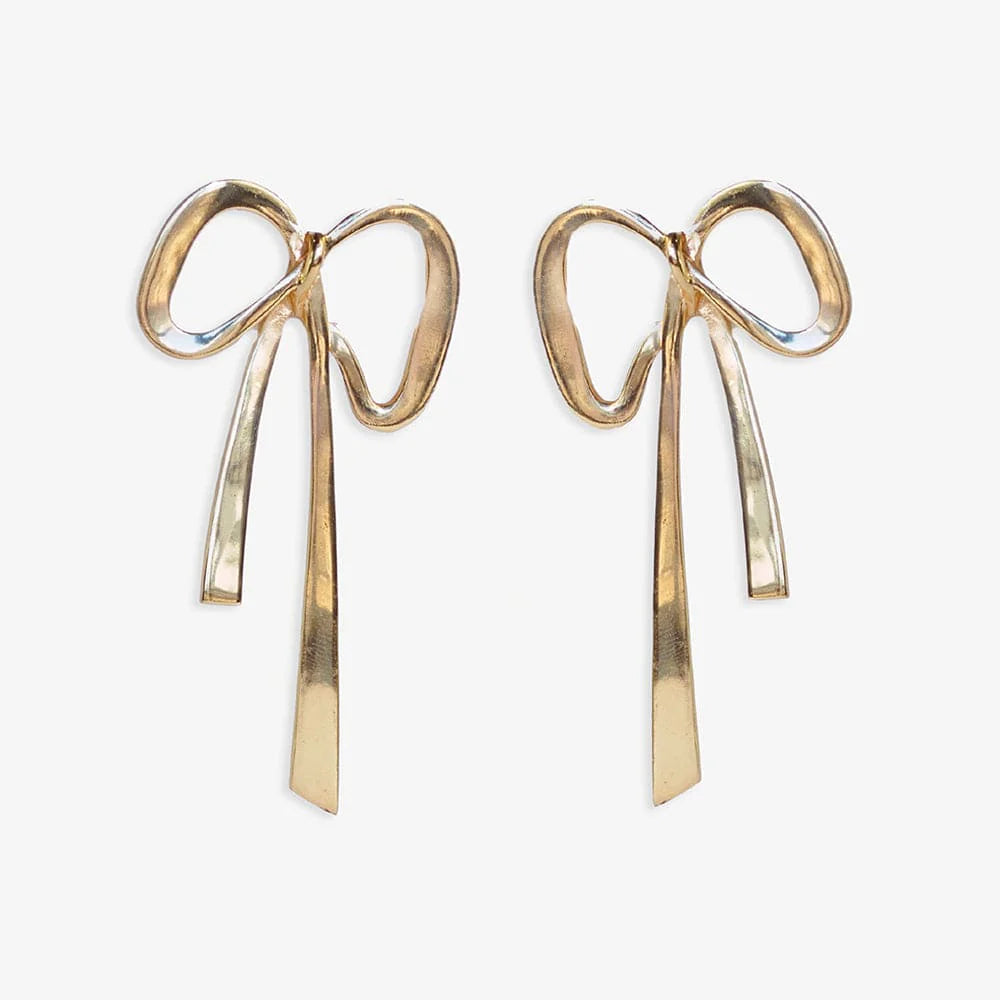 golden metal bow shaped earrings on a white background.