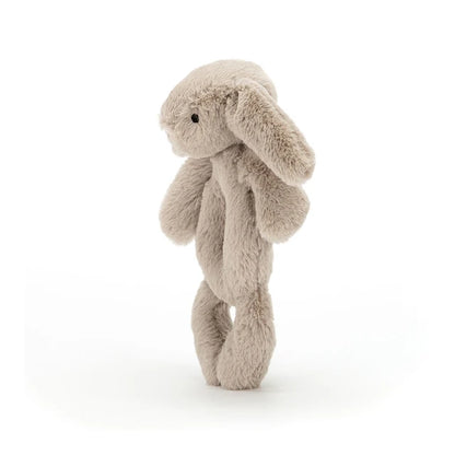 side view of beige Bashful Bunny Ring Rattle Plush Toy