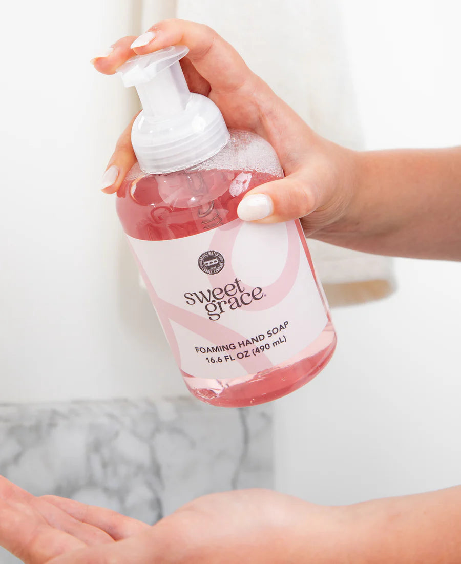 hand holding bottle of Sweet Grace Foaming Hand Soap