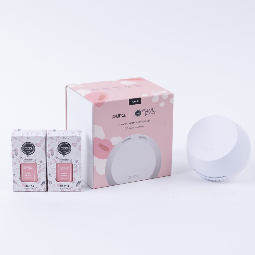 pura device set next to box packaging and 2 sweet grace vials