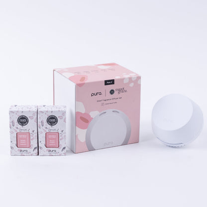 pura device set next to box packaging and 2 sweet grace vials