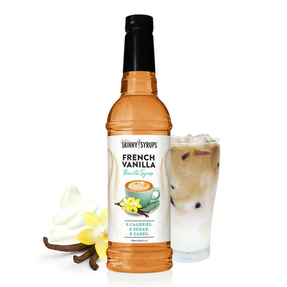 bottle of french vanilla skinny syrup set next to arranged with a beverage, vanilla beans, and whipped cream.