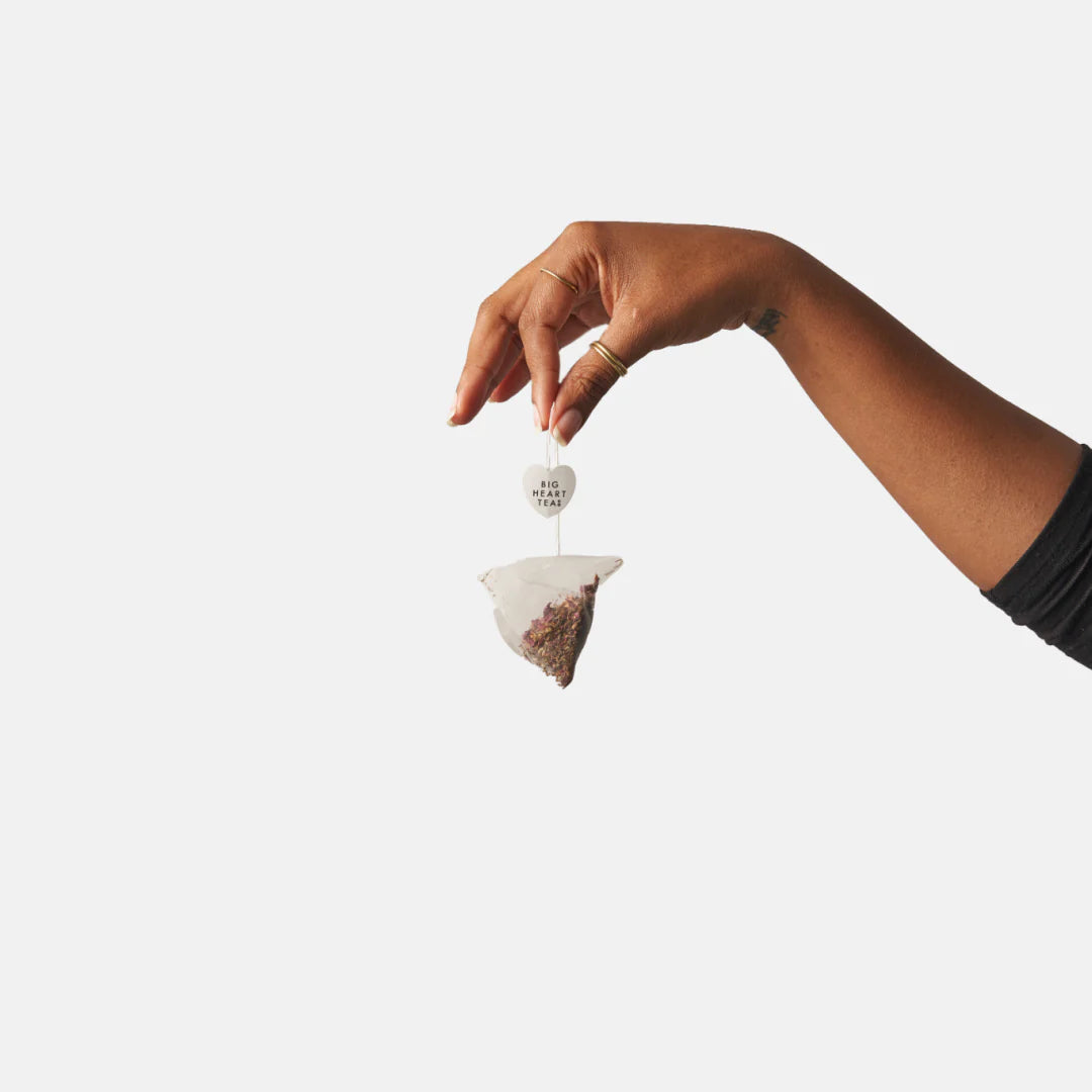 hand holding Chai Tea Bag by its string