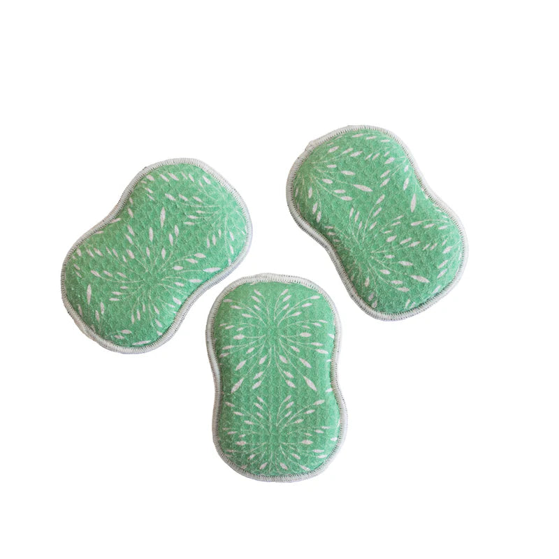 3 green reusable sponges with white floral patterns arranged on a white background.