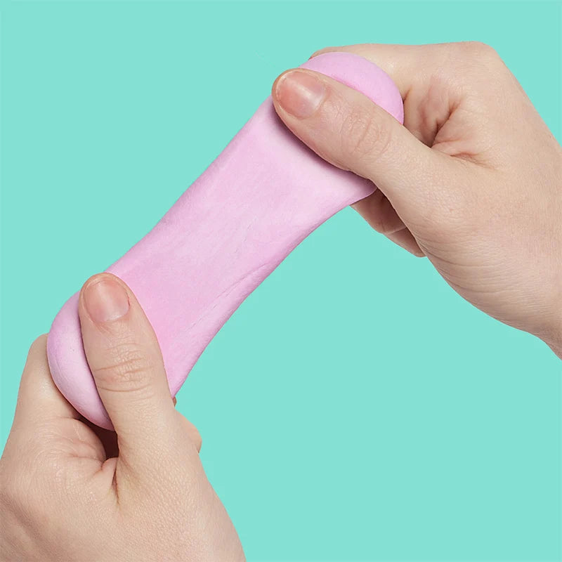 hands playing with blush fidget putty shown on a seafoam green background