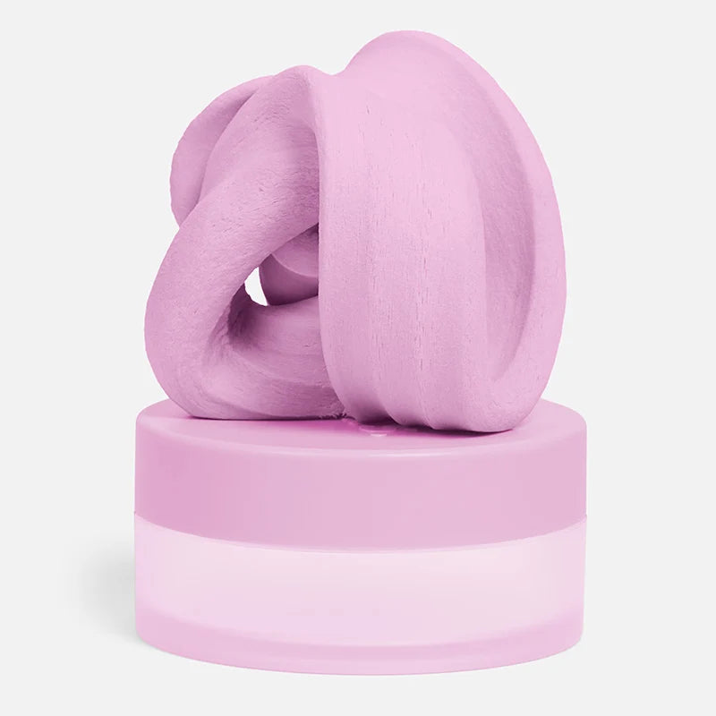 Pink fidget putty in a knot-shape set on its container shown on a white background