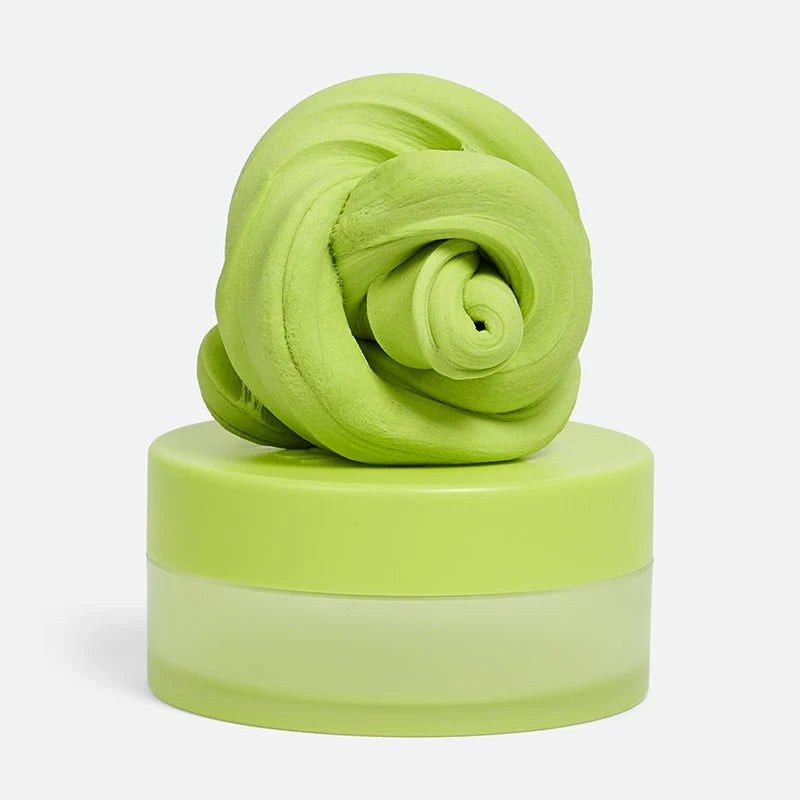 Green textured calming putty on a white background