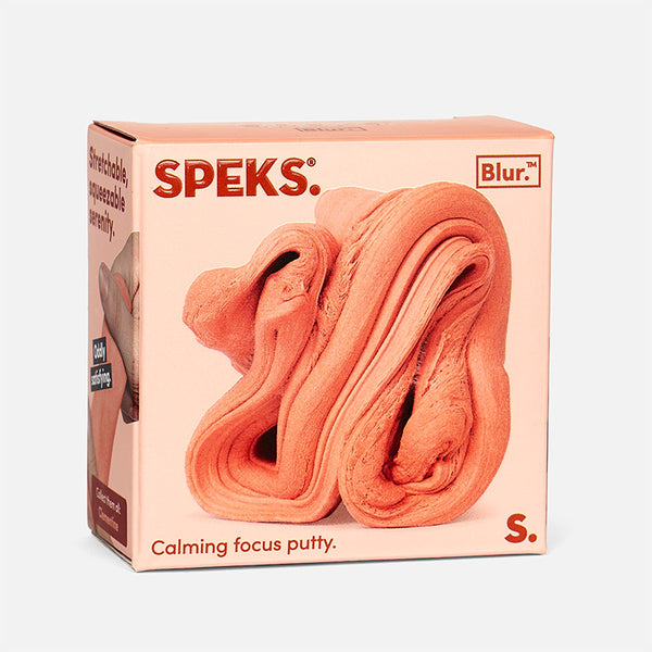 Box of Speks calming focus putty with a pinkish-orange color on a white background