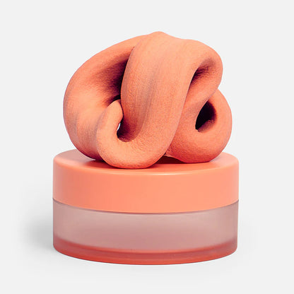 A peach-colored, textured, knotted fidget putty set against a clean white background.