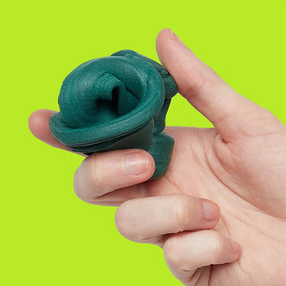 hand holding dark green fidget putty shown on a lime green background