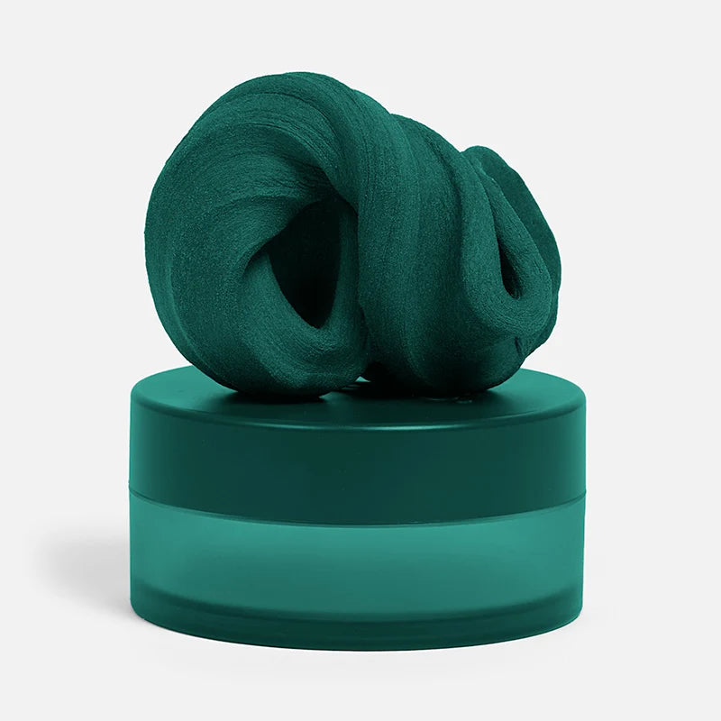 dark green fidget putty set on its container shown on a white background