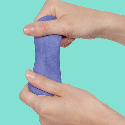 hands playing with twilight fidget putty shown on a pale green background