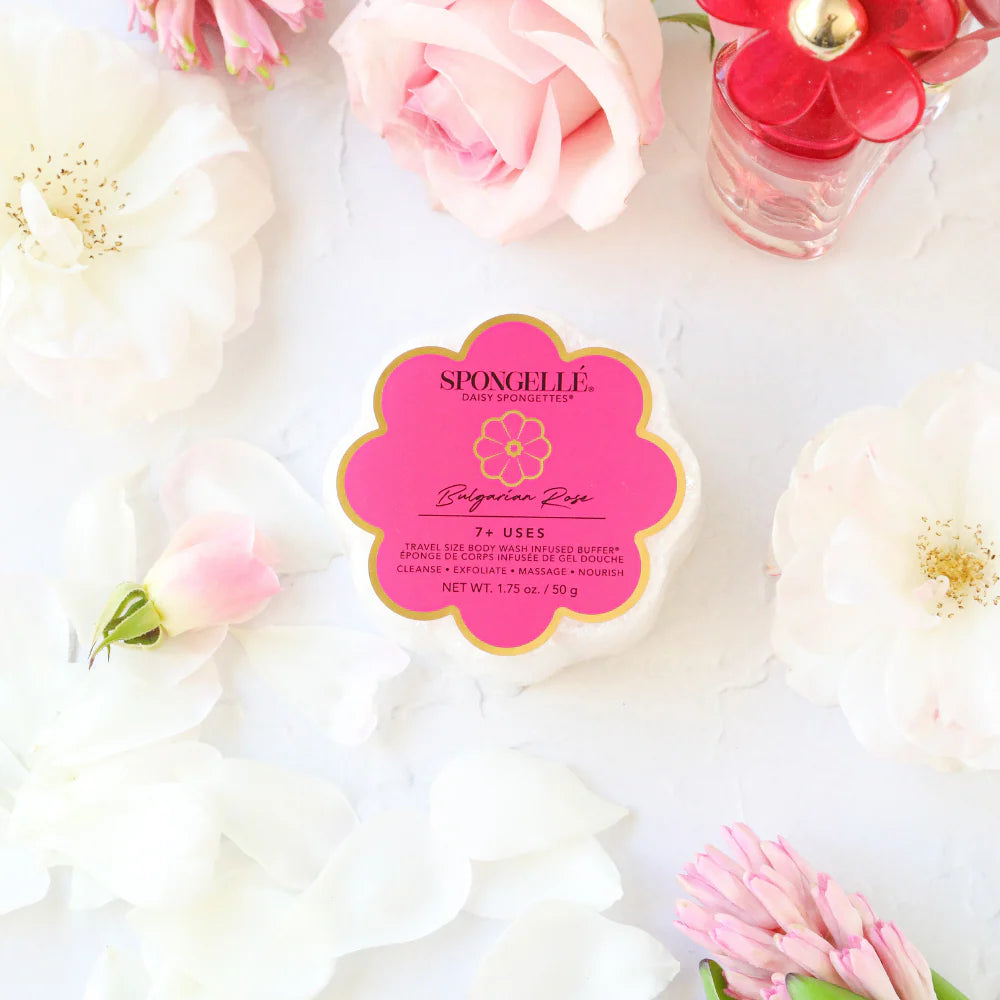 Spongelle product with floral arrangement on a light background