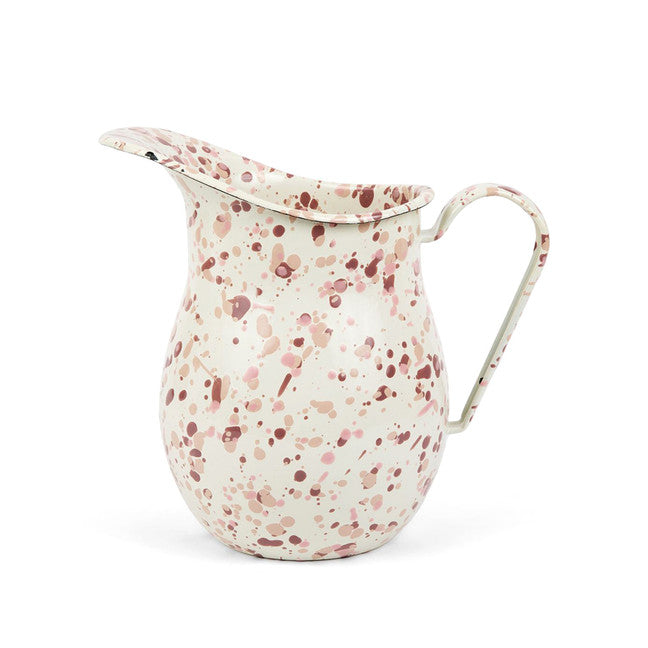 off-white enamel pitcher with splatter paint in shades of pinks.