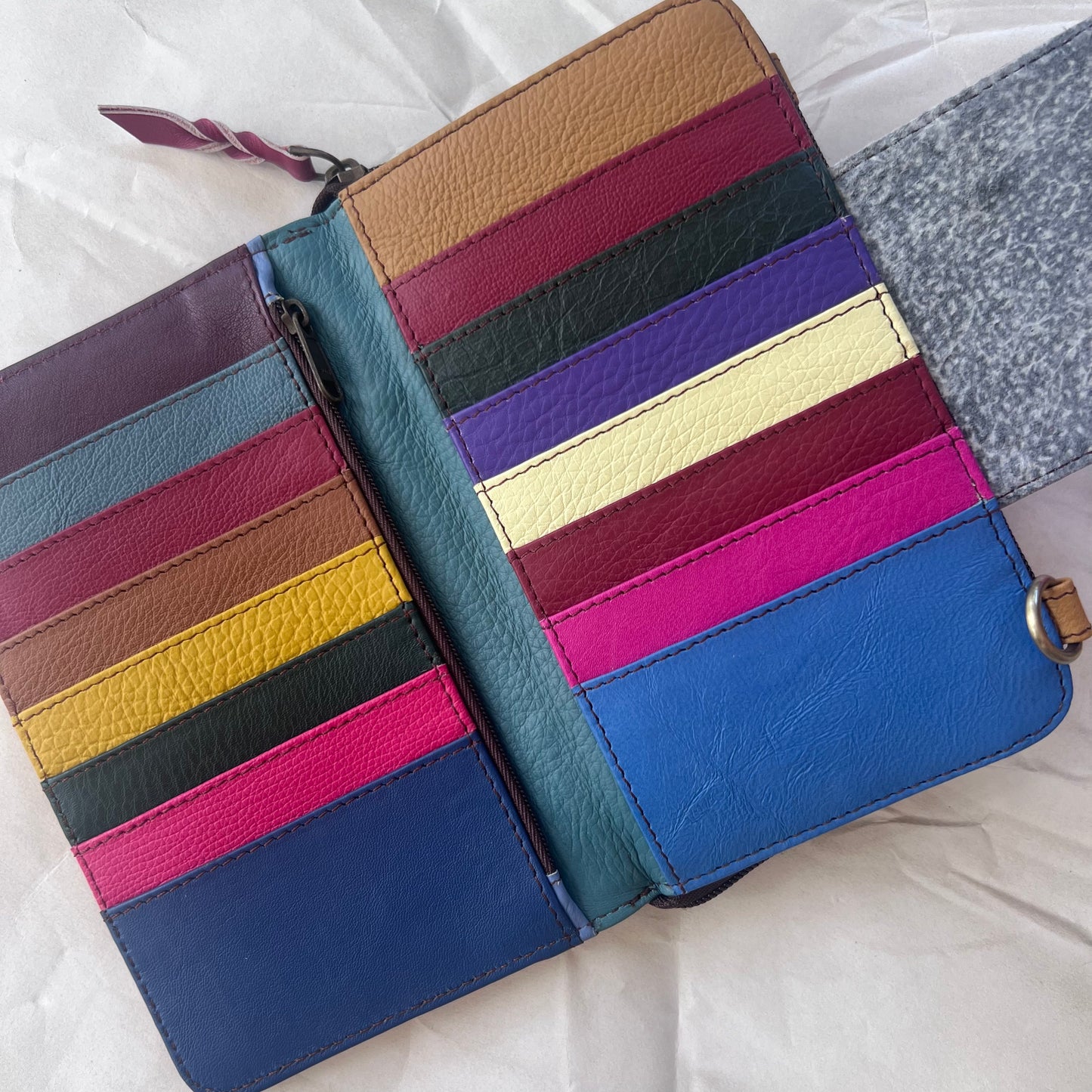 view under magnetic flap of red Beatrice Clutch showing colorful card slots