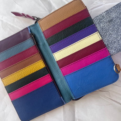 view under magnetic flap of red Beatrice Clutch showing colorful card slots