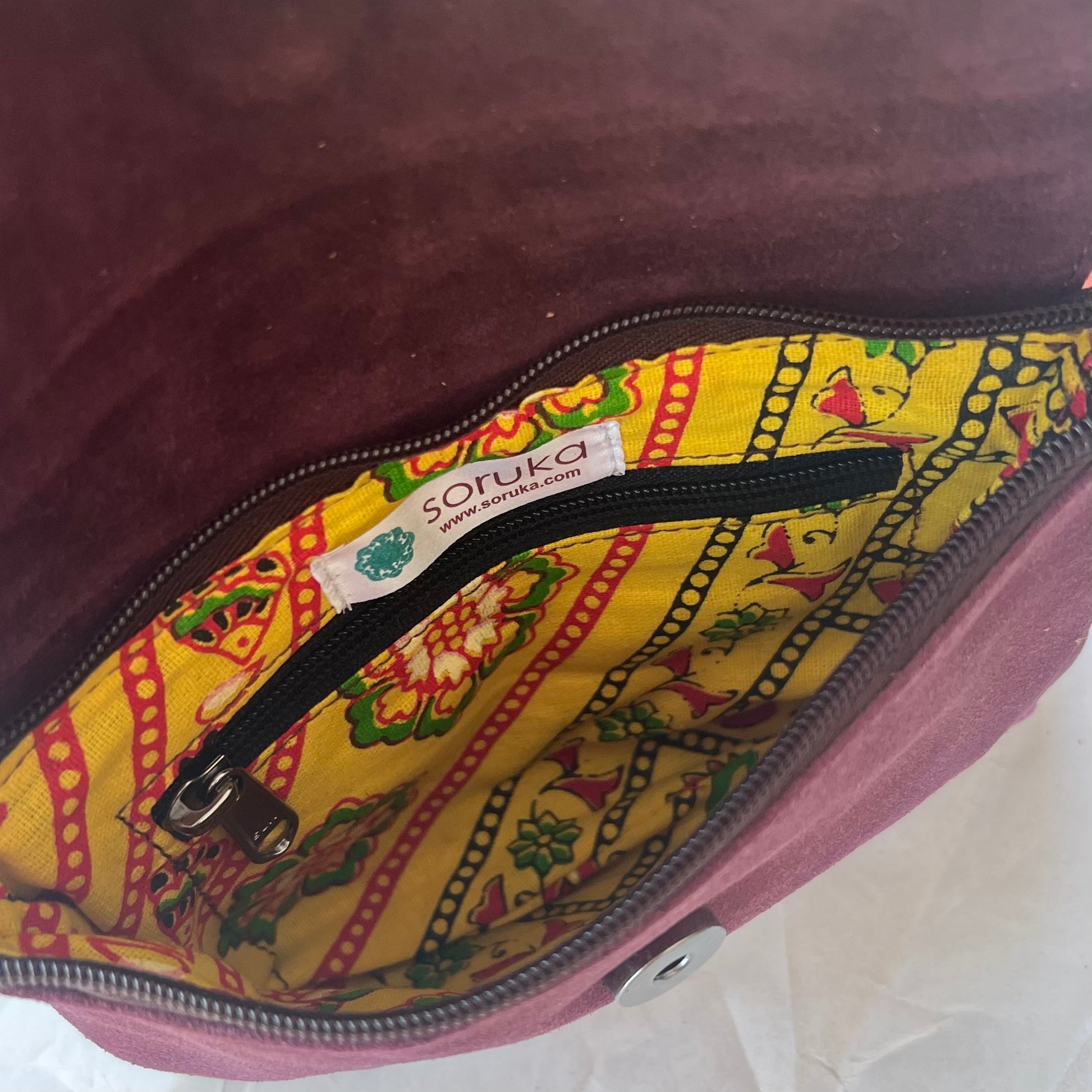 interior of bag showing inner zipper pocket.