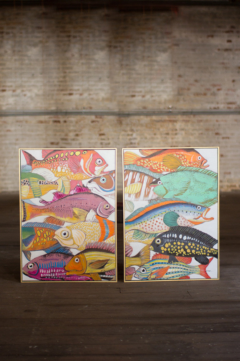 2 oil painting of colorful fish set on a wooden floor with a brick wall in the background.