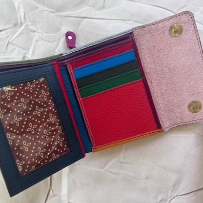 olive rings wallet laying open showing colorful card slots