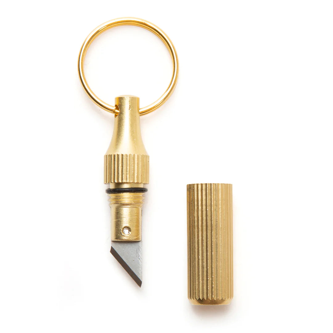 Mini Knife Keychain with cap off on a white background.