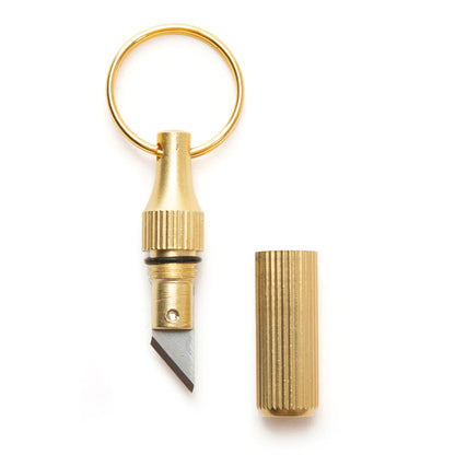 Mini Knife Keychain with cap off on a white background.
